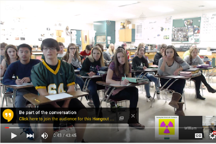 A classroom of students participate in the webinar.